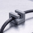 Grey Cable Mag holding a cable